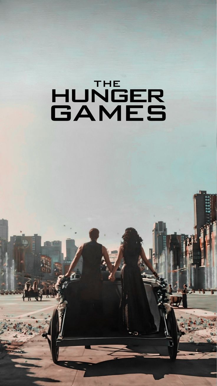 the poster for the upcoming film, the hunger games with two people sitting on a motorcycle