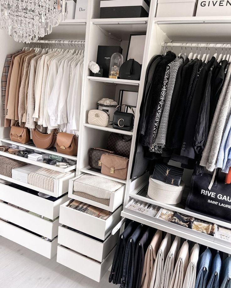 an organized closet with clothes and handbags