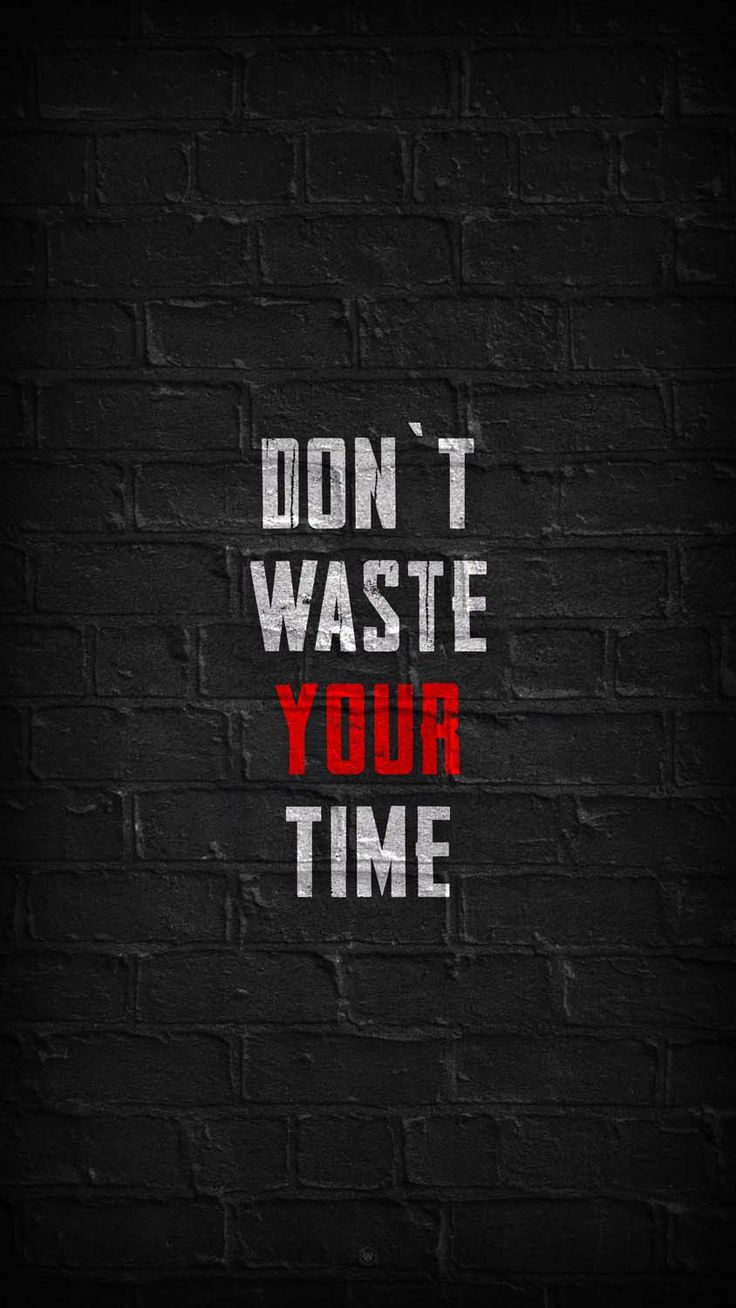 a brick wall with the words don't waste your time on it in red and white