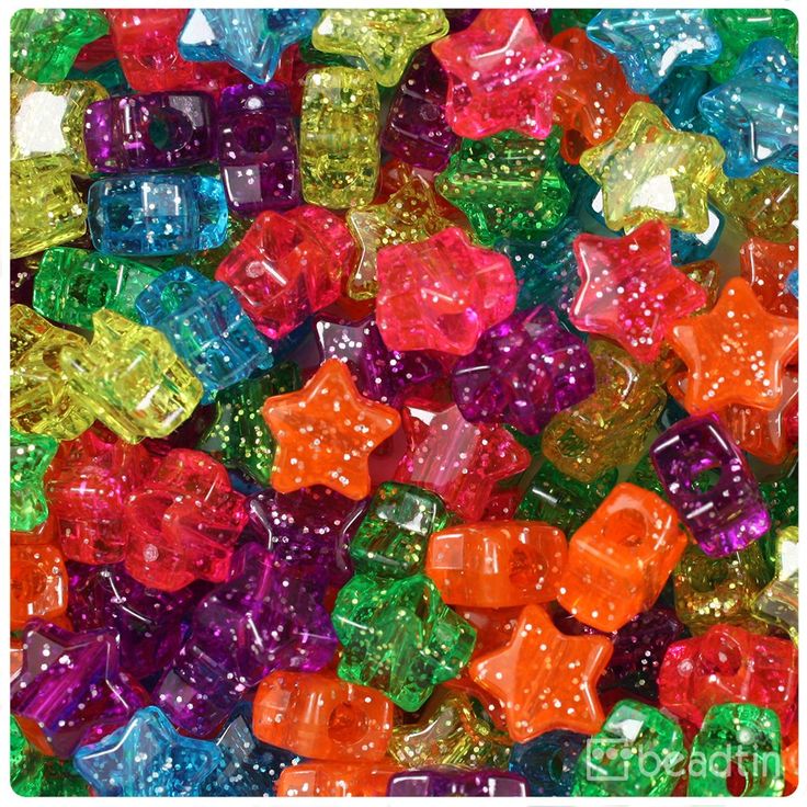 many different colored gummy bears are stacked on top of each other in this pile