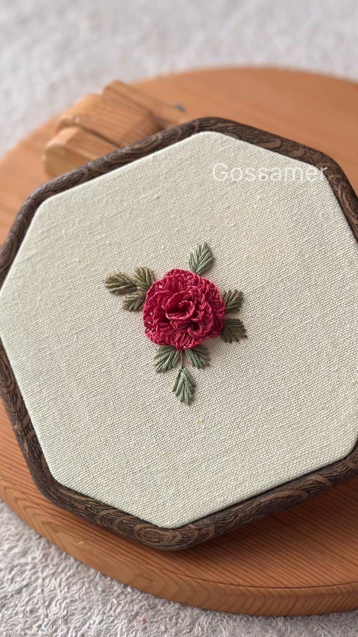 a close up of a piece of cloth with a flower on it