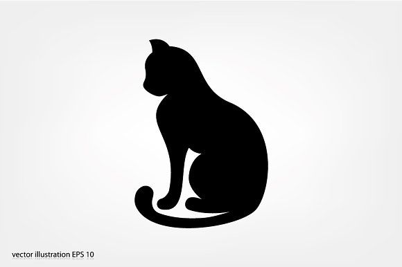 a black cat sitting on top of a white wall