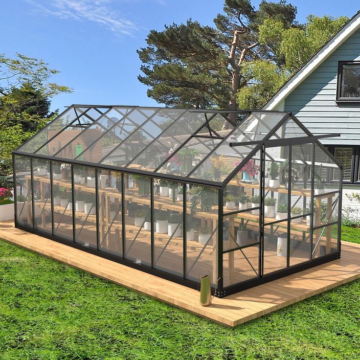 a house with a glass roof and wooden deck in front of it on the grass