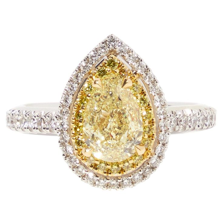 a yellow and white diamond ring