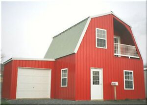 a large red barn with two garages on the front and second story above it