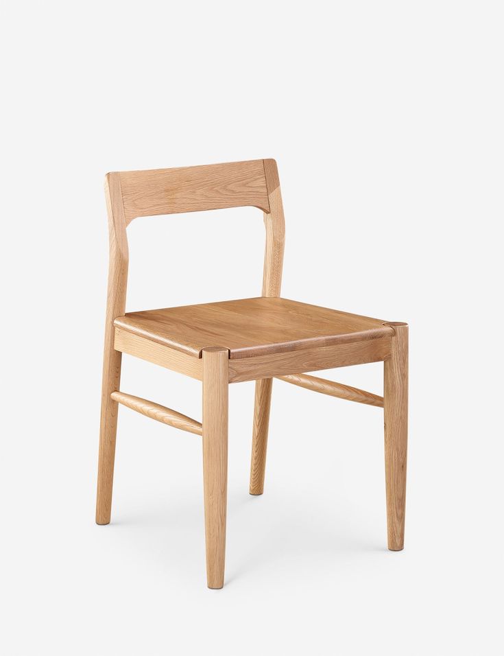 a wooden chair on a white background with no one in the room to see it