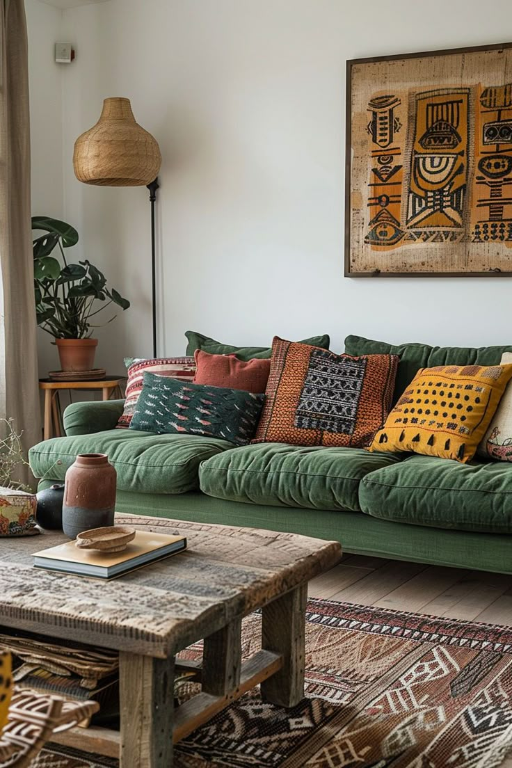 a living room filled with lots of green couches next to a wooden coffee table