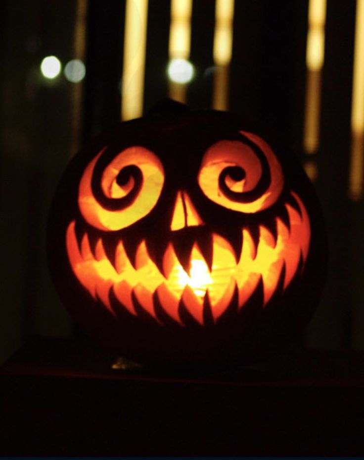 a carved jack o lantern sitting on top of a table