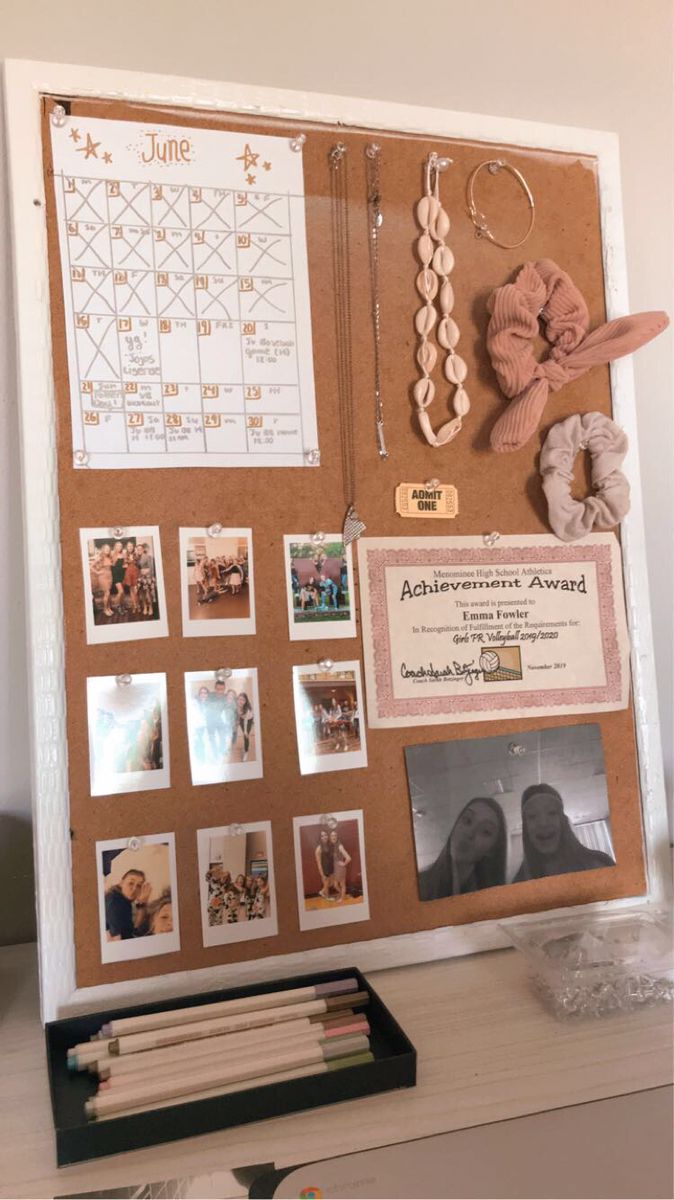 a bulletin board with pictures and other items on it