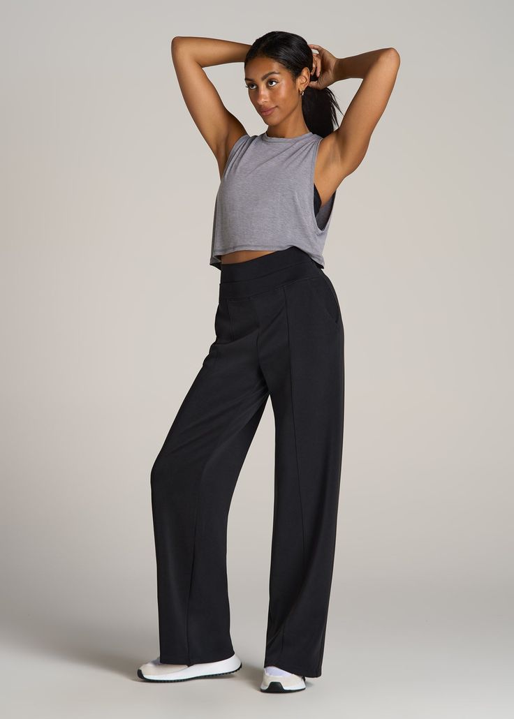 About Our Wide Leg Ultra High Rise Pant Comfort and style combine on these effortlessly chic pants for tall women. Designed with an ultra-high rise that's extra flattering, they have a modern wide leg with front seam details to highlight your long legs. We've made these tall women's pants specifically for your height, with a full length leg and inseam that's actually long enough. The tri-blend fabric is naturally wrinkle-resistant, and ready for a day of running errands or lounging at home. Two Solid Color Wide Leg Activewear For Fall, Sleek High Rise Bottoms For Spring, Black Wide Leg Full-length Pants With Relaxed Fit, Black Wide Leg Athleisure Pants, Modern High Waist Stretch Bottoms, Modern Stretch High Waist Bottoms, Black 4-way Stretch Straight Leg Bottoms, Modern High-waist Stretch Bottoms, Spring Athleisure Wide Leg Full Length Pants