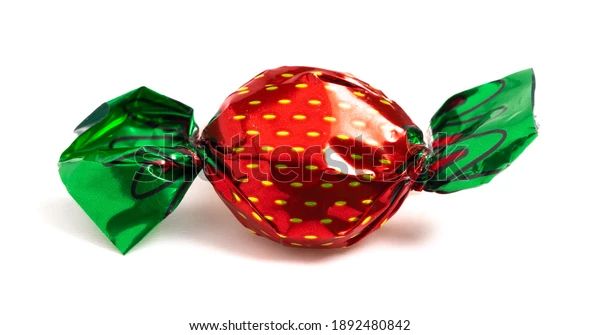 an apple wrapped in green and red foil with leaves on it's side, against a white background