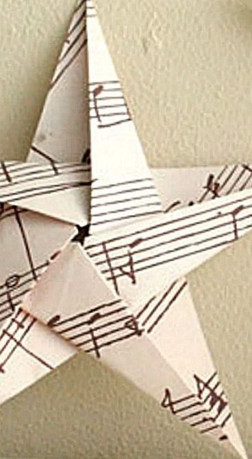 an origami star with musical notes on it