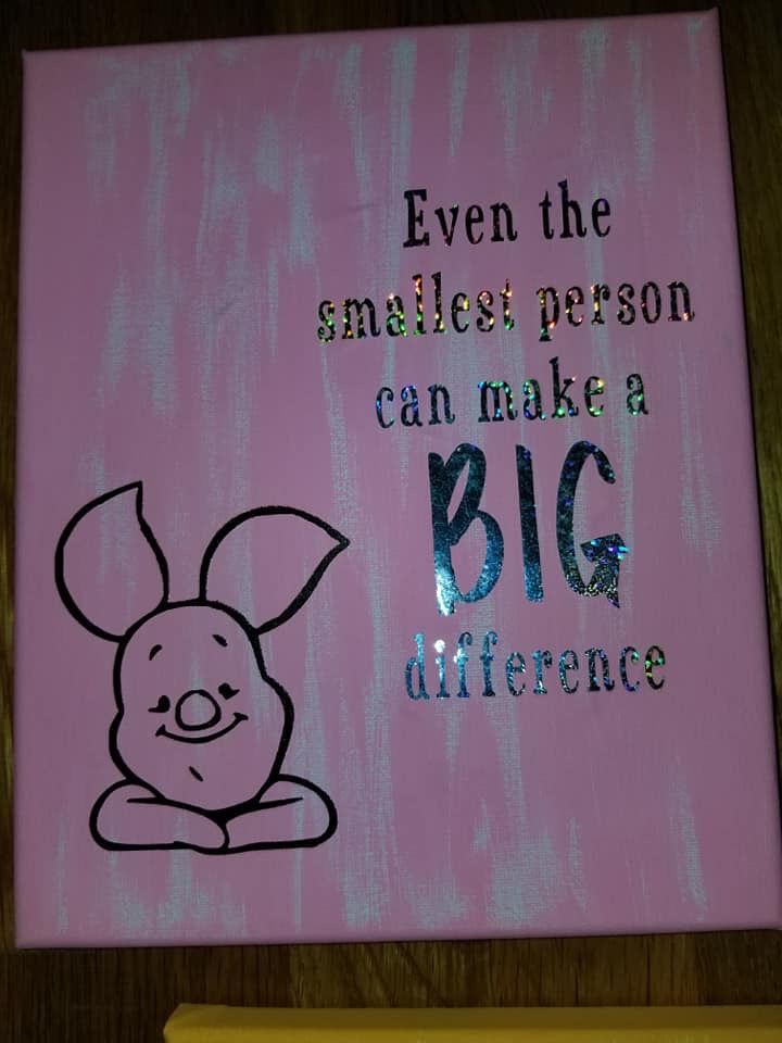 a pink canvas with an image of a pig on it and words written in cursive writing