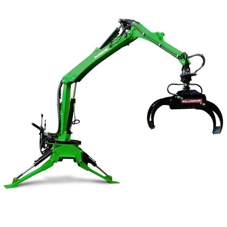 a green and black machine sitting on top of a white background