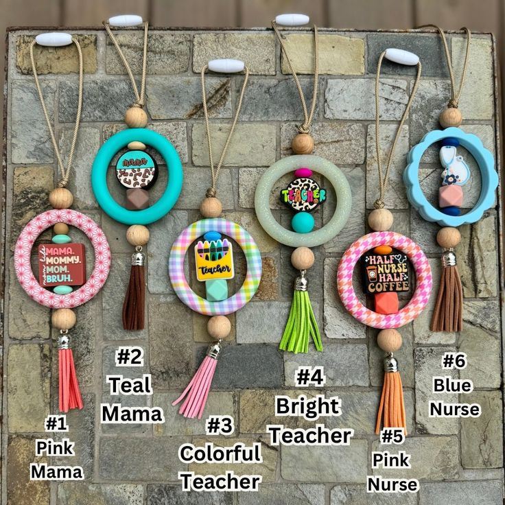 a bunch of items that are hanging on a brick wall with the words mama, bright, colorful teacher and pink nurse