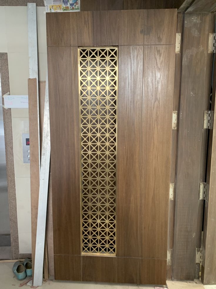 a wooden door being installed in a room