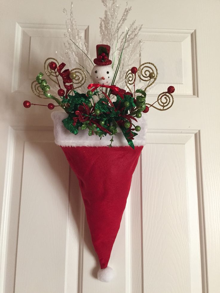 a red christmas stocking hanging on a door