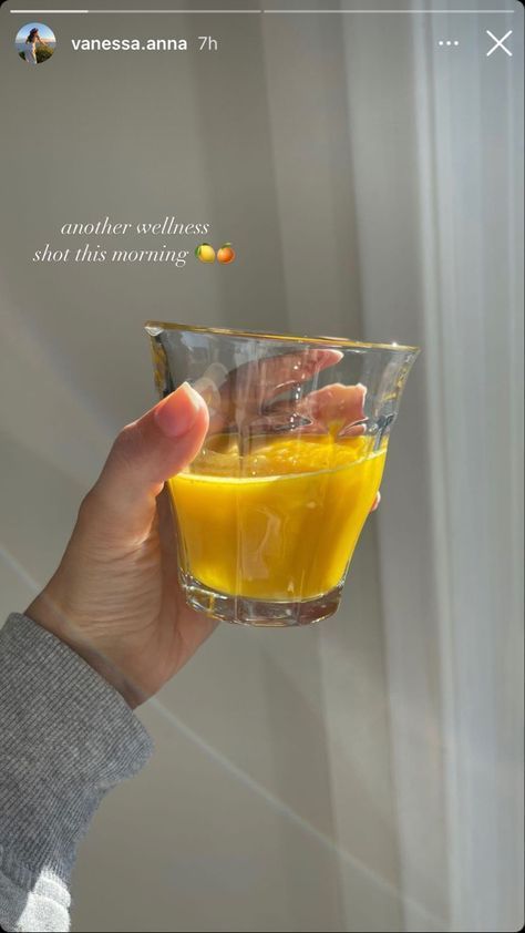 a person holding up a glass with orange juice in it and the caption reads, another stillness show this morning