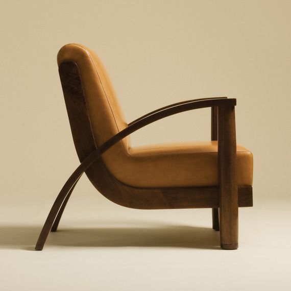 a chair that is made out of wood and leather