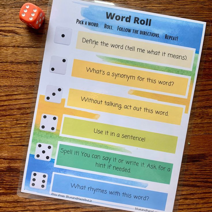 a printable word roll game with dices on the table