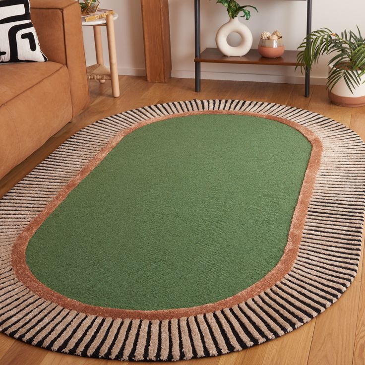 a living room with a couch and rug on the floor