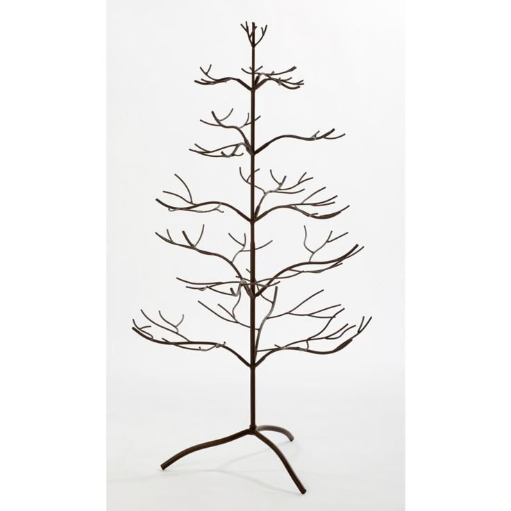 a tall metal tree is shown against a white background and has no leaves on it