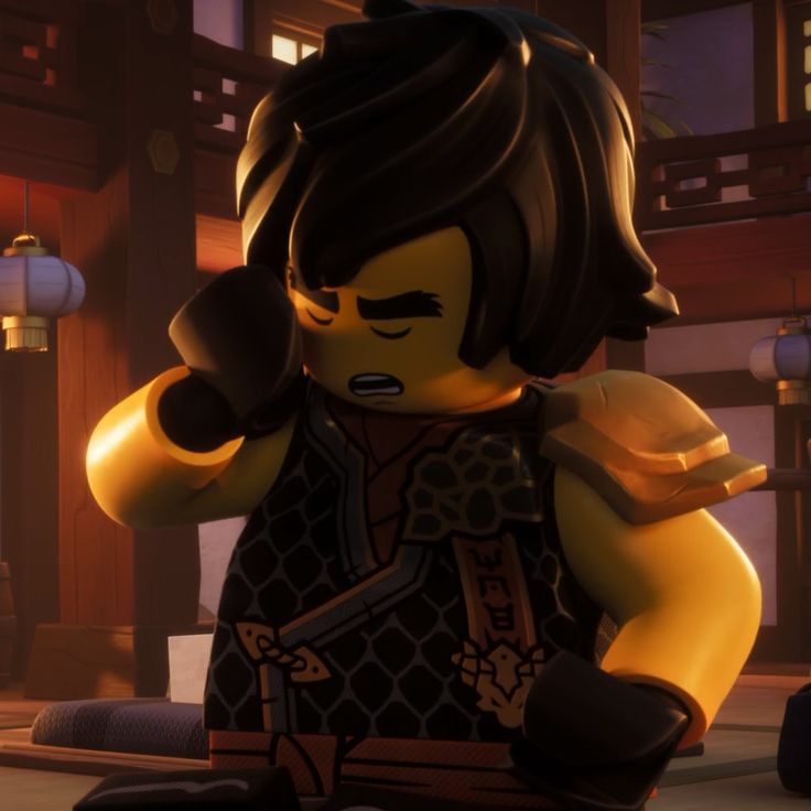 the lego movie character is holding his fist up