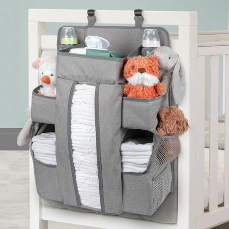 a baby crib with stuffed animals and diapers in it