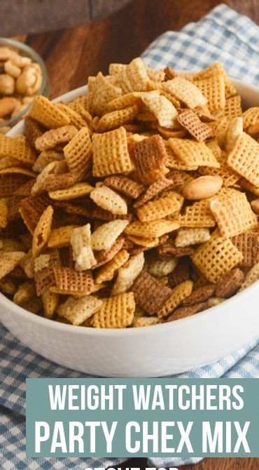 a bowl filled with chex mix on top of a table