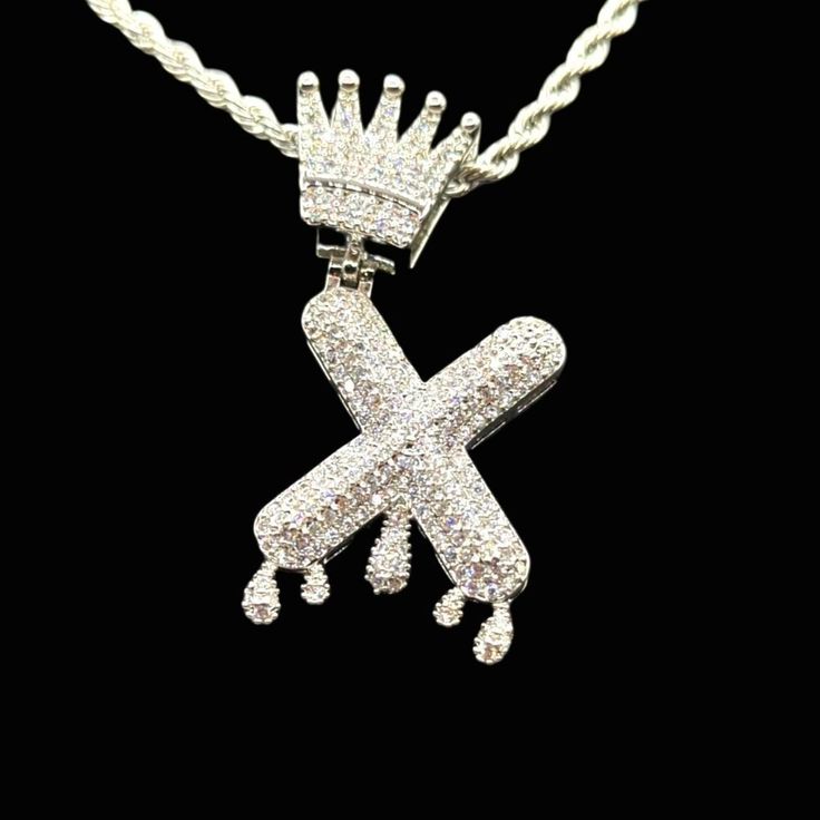 New Icy Supreme Quality 14k White Gold Finish Crown Drip X. Letter Pendant Over Brass Dipped In Gold 5xtimes To Include A Free 14k White Gold Finish 18inch X 3mm Rope Chain For Men. * Icy Crown Letter X. Letter Pendant * Supreme Quality & Dipped In Gold 5xtimes * 14k White Gold Finish X5 * Over Brass * Simulated Baguette Diamonds * Micro Pave Setting * Pendant Length: 1.9 Inch * Pendant Width: 0.75 Inch * So Icy You Have To See To Believe. * Free Rope Chain * 14k White Gold Finish * Over Stainle Celebrity Style Jewelry, X Letter, Mens Cross Necklace, Chain For Men, Letter X, Silver Signet Ring, Baguette Diamonds, Mens Leather Bracelet, Cz Stud Earrings