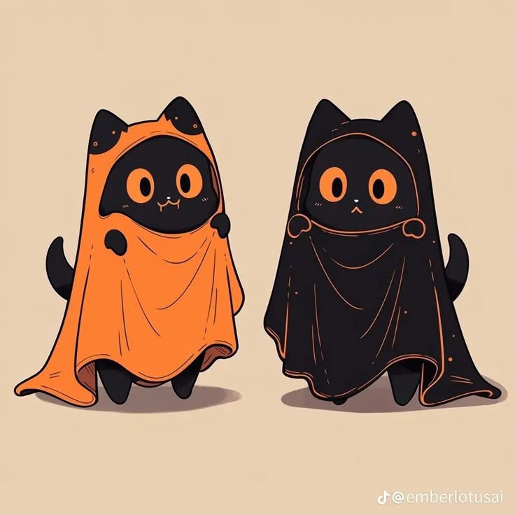 two black and orange cats wearing halloween costumes