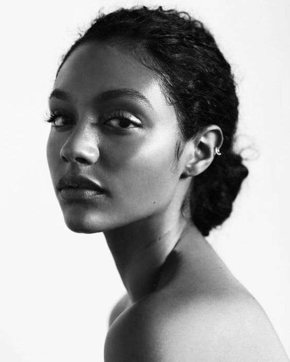 a black and white photo of a woman's face