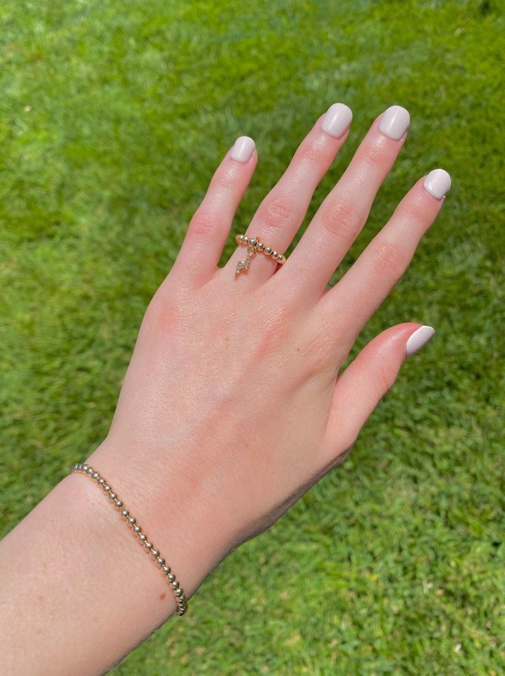 This 14k gold-filled lightning bolt ring is waterproof and super cute! Be sure to select your ring size :) Great for gifts! Our bracelets and rings can be worn in water without tarnishing! Lightning Bolt Ring, Stretchy Rings, Bracelet Stacks, Bracelets And Rings, Bolt Ring, Charm Ring, Charm Rings, Lightning Bolt, Heart Bracelet