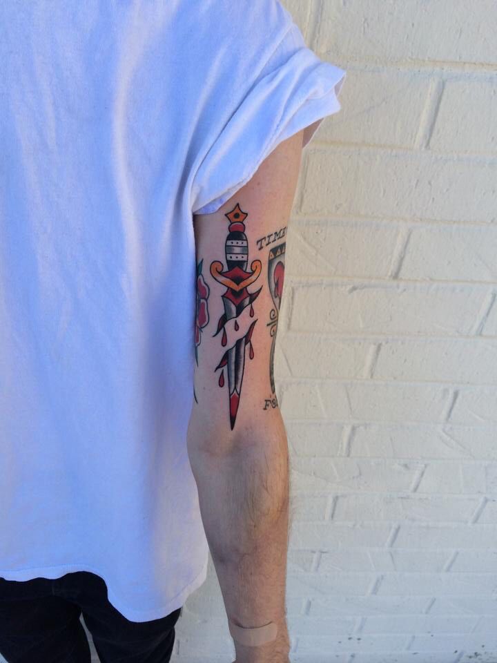 a man with a tattoo on his arm