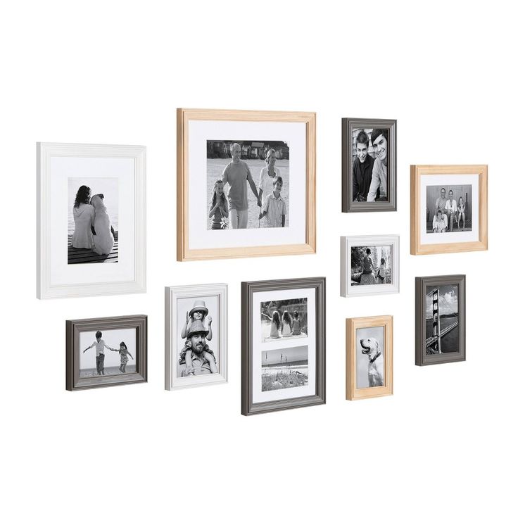 an assortment of black and white photos hanging on a wall with multiple frames around them