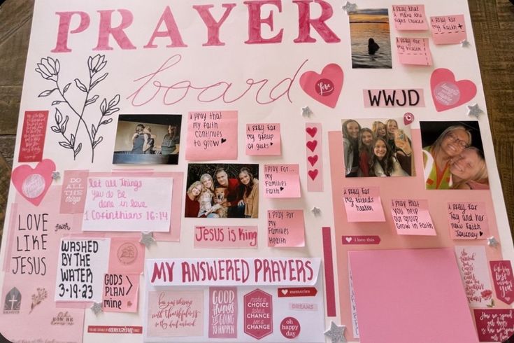 a bulletin board covered in pink and white paper with pictures, hearts, and words