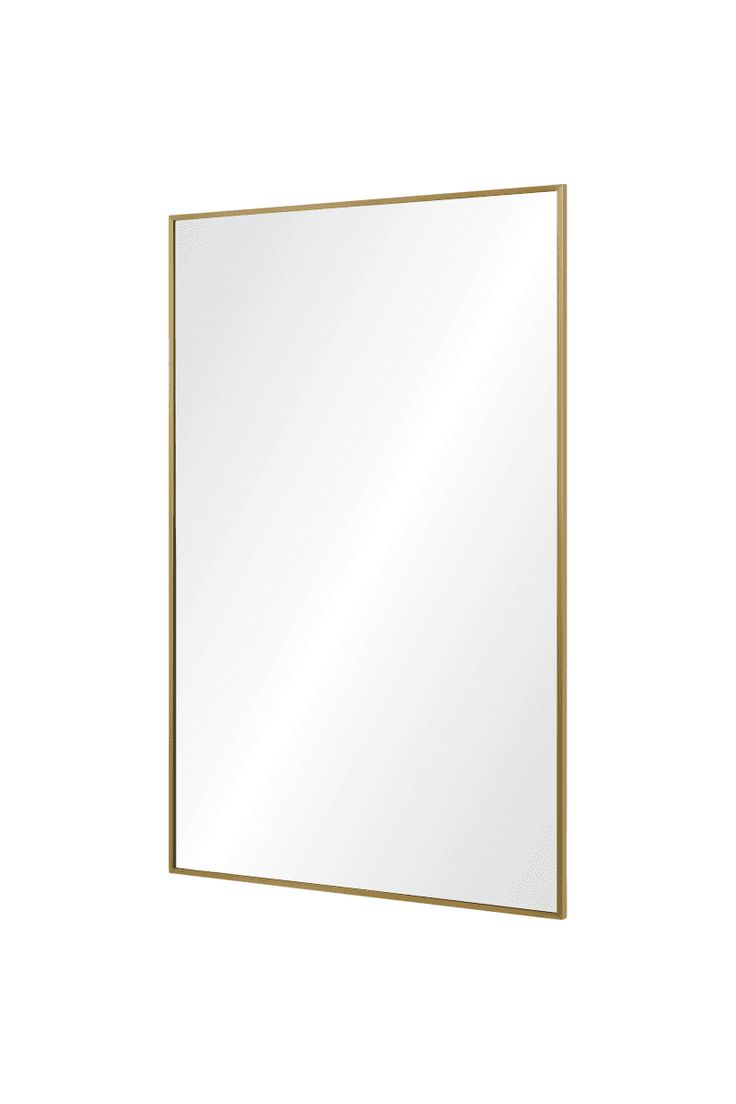 a gold framed mirror on a white wall with an empty space for the image to be taken