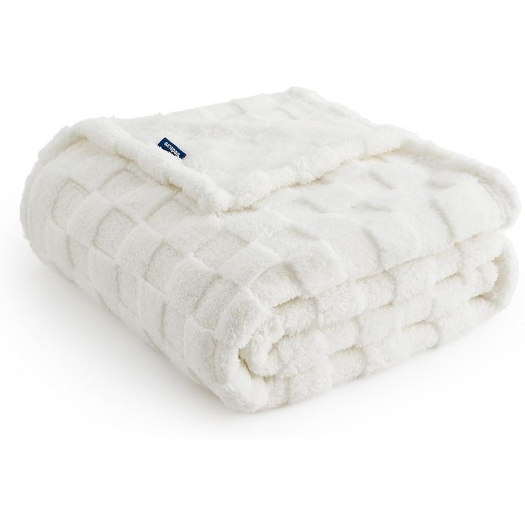 a white blanket folded on top of each other