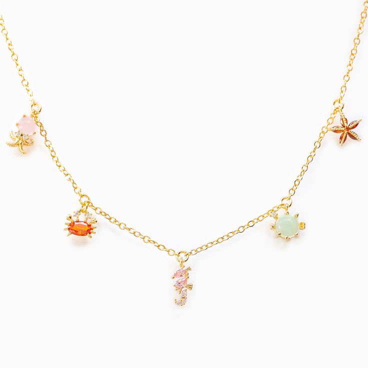 Take a plunge into the ocean in this sea-inspired necklace! 18k gold plated, 18k rose gold plated, or rhodium plated over brass with a protective coating Cubic zirconia stones 13" chain with a 2" extension Shop our entire Under the Sea Collection here! Sale items are final sale. Sea Necklace, Stella Marina, Preppy Jewelry, Ocean Necklace, Gloss Labial, Beach Necklaces, Jewelry Accessories Ideas, Jewelry Essentials, Jewelry Lookbook