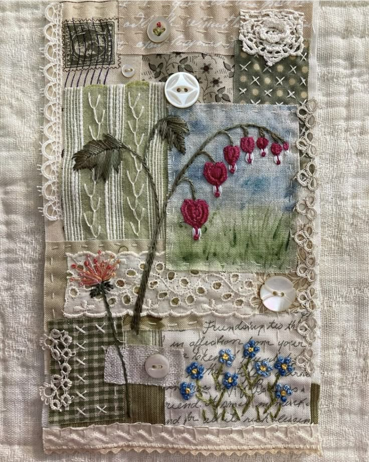 a patchwork quilt with flowers and lace on it's edges, along with buttons