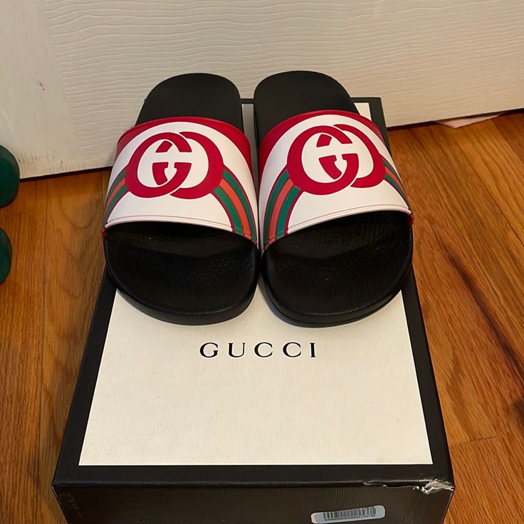 Gucci Logo Multicolor Slides. Mens Size 7. I Am A Womens Size 10 & They Fit Perfectly. Brand New Never Worn! Green, Orange, Red, And White Slide. Comes With Original Box, 2 Shoe Bags, And Original Tags. 100% Authentic. Gucci Black Sneakers With Logo Print, Black Gucci Sneakers With Logo Print, White Gucci Slip-on Slides, White Flat Gucci Slides, Designer Red Gucci Sneakers, Designer White Gucci Slides, White Designer Gucci Slides, Red Gucci Slides With Branded Insole, White Gucci Slip-on Sneakers