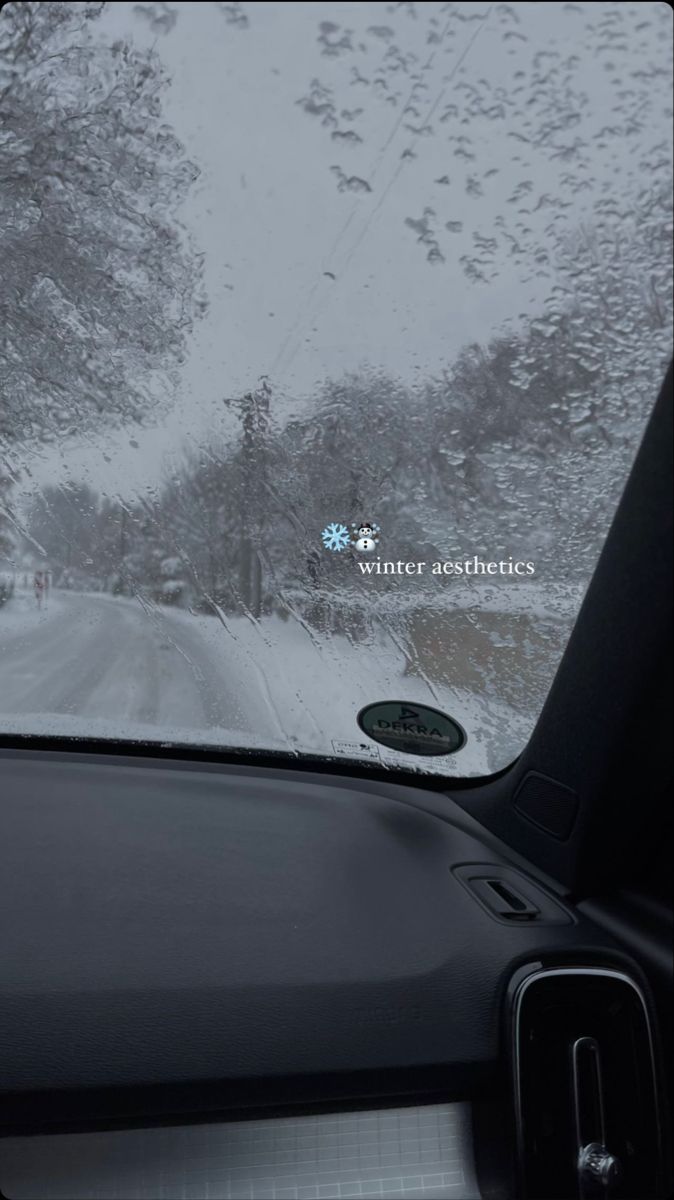 the windshield of a car on a snowy road