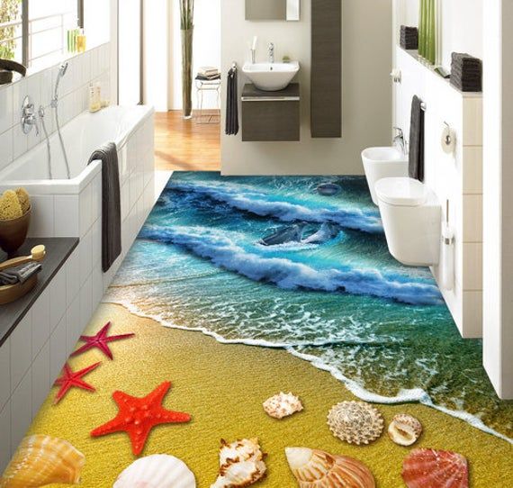 the bathroom is decorated with starfish and seashells on the floor, along with an ocean themed rug