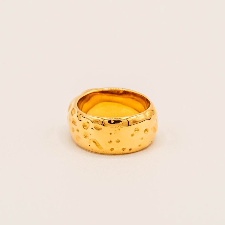 Crafted of gold with a titanium core, this hammered texture ring has a seemingly organic feel that brings a natural touch to any ensemble. Materials: Finish: 18K gold platedCore: Titanium steel Gold Hammered Nugget Rings, Gold Hammered Wide Band Ring, Gold Hammered Ring Of Recycled Gold, Gold Hammered Ring In Recycled Gold, Hammered Gold Ring In Recycled Material, Hammered Gold Ring In Recycled Gold, Hammered Yellow Gold-plated Rings, Hammered Yellow Gold Plated Rings, Hammered Gold Ring Made Of Recycled Gold