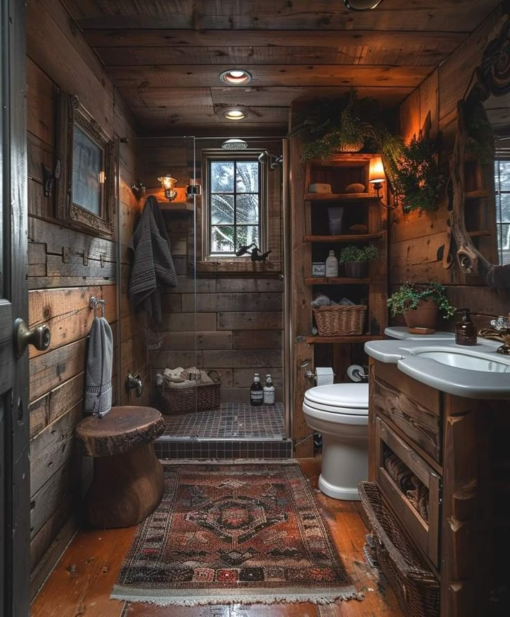 a rustic bathroom with wood paneling and tile flooring, along with a rug on the floor