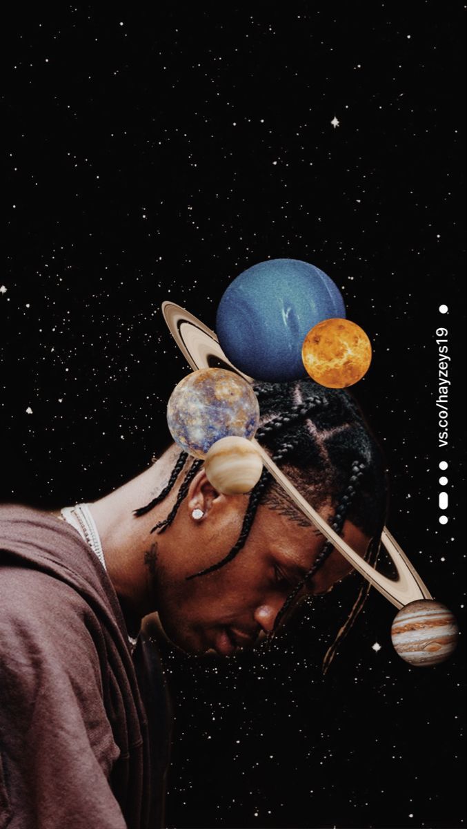 a man with dreadlocks and planets on his head looking down at the ground