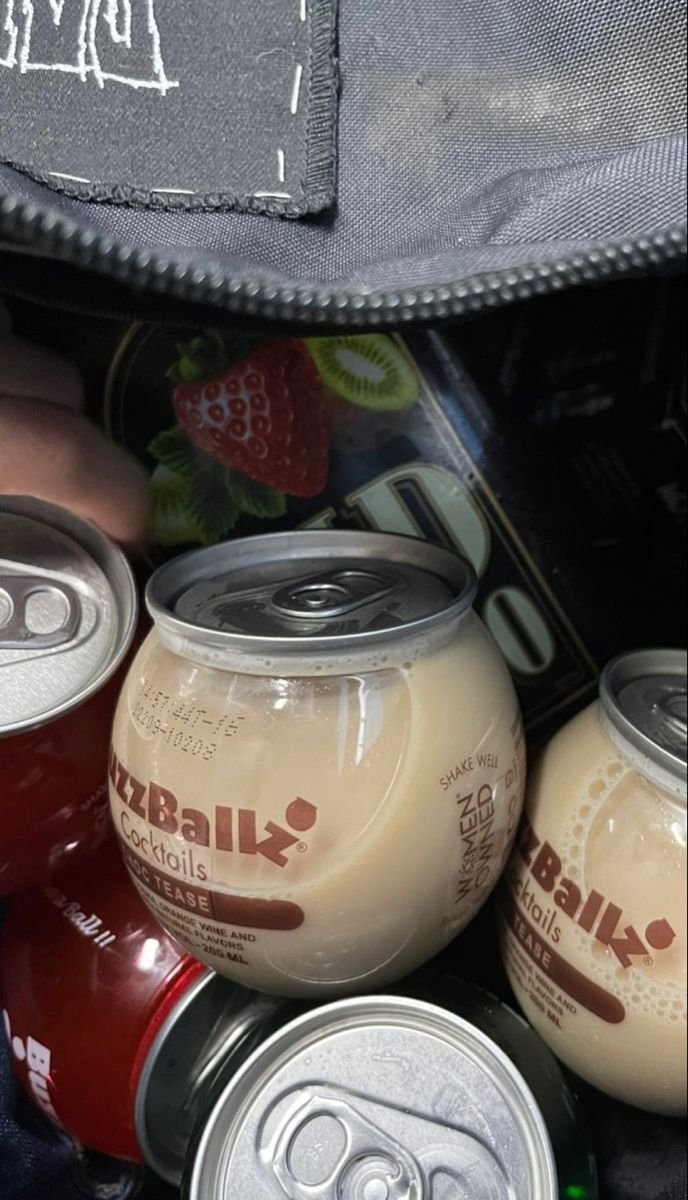 several different types of sodas and soft drinks in a bag with the lid open