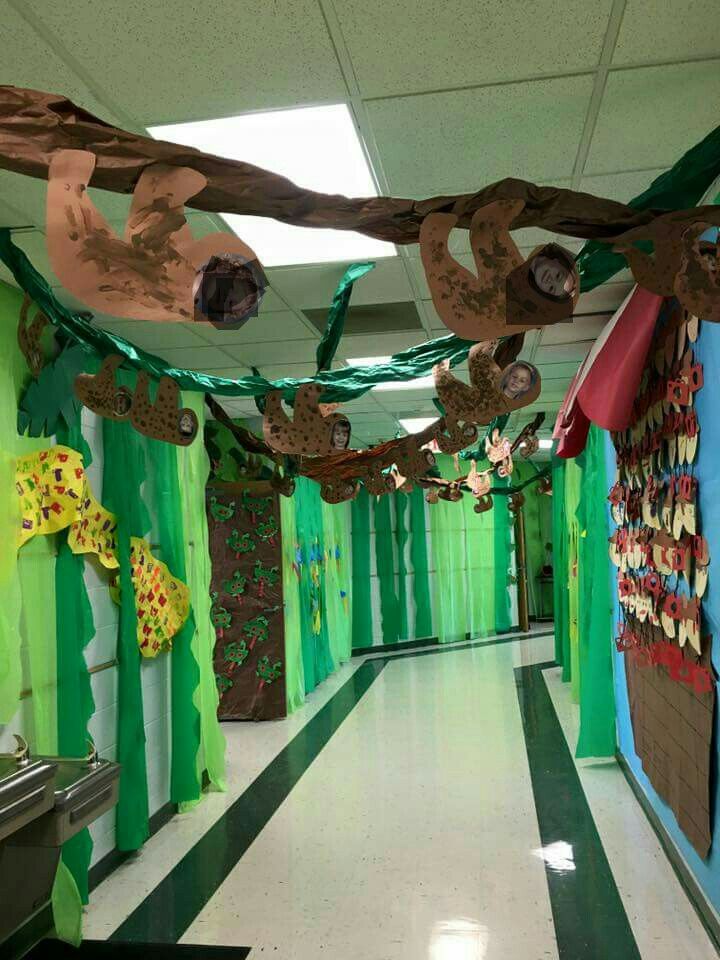 the hallway is decorated with green and brown paper streamers that are hanging from the ceiling