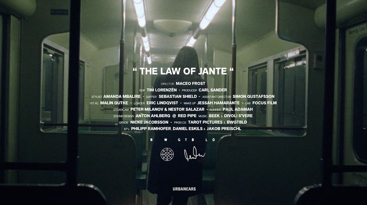 a person standing in front of a window with the words'the law of ante'on it