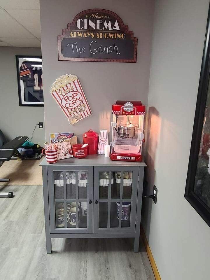 a gray cabinet with popcorn and soda on top